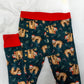 Pajama pants with sloth pattern and red cuffs on a white background